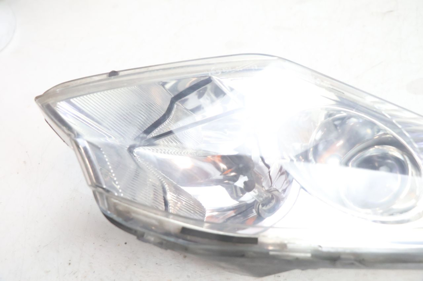 photo de FAROL DIANTEIRO ESQUERDO PEUGEOT SATELIS 125 (2006 - 2009) - Zoom do estado de desgaste