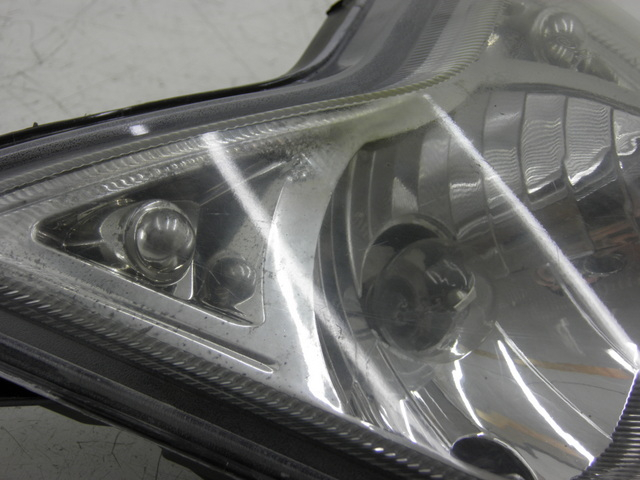 photo de FAROL DIANTEIRO QINGQI SPEEDY 50 (2005 - 2007) - Detalhe da peça